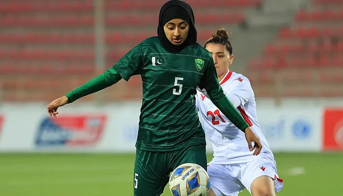 Amina Hanif (L) controls the ball during a match. — PFF