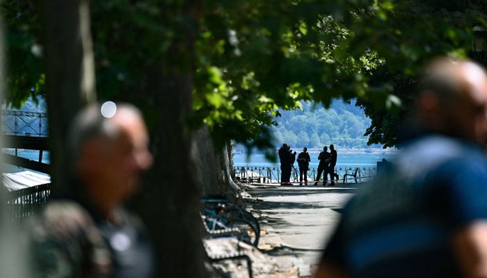 Security personnel gather in Annecy, south-eastern France on June 8, 2023, following a mass stabbing in the French Alpine town.