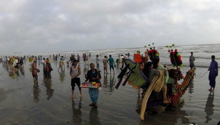 People enjoy pleasant weather during visit at Seaview beach in Karachi on May 16, 2023. — INP