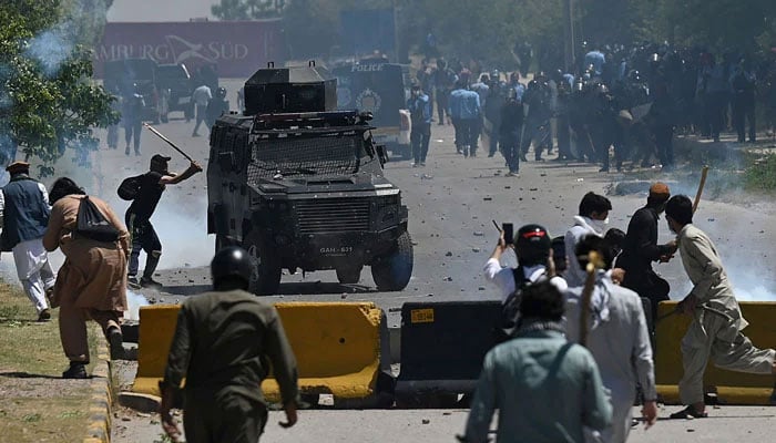 PTI party activists and supporters clash with police during a protest against the arrest of their leader, in Islamabad on May 10, 2023. — AFP