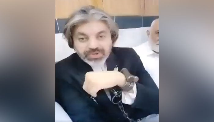 Pakistan Tehreek-e-Insaf leader Ali Muhammad Khan is speaking to reporters in this still taken from a video on June 10, Friday. — Twitter/MurtazaViews