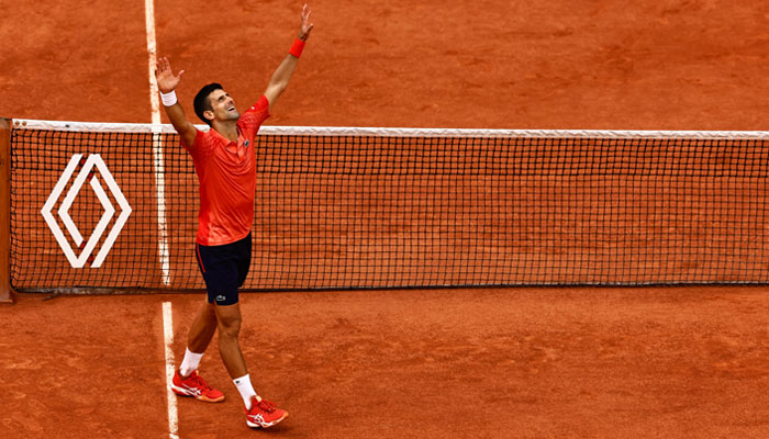 Serbias Novak Djokovic celebrates his victory over Norways Casper Ruud during their mens singles final match of the Roland-Garros Open tennis tournament at the Court Philippe-Chatrier in Paris on June 11, 2023. — Reuters