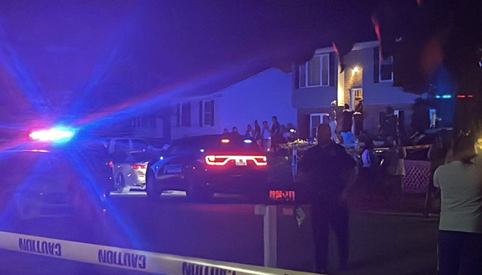 Police, among others, can be seen outside a house in Annapolis, Maryland where the mass shooting took place on June 12, 2023. — Twitter/@rawalerts