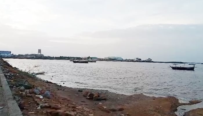 Fishing boats can be seen near the shore at Karachis Chashma Goth, om June 13, 2023, in this still taken from a video. — Geo News via Qamar Ali