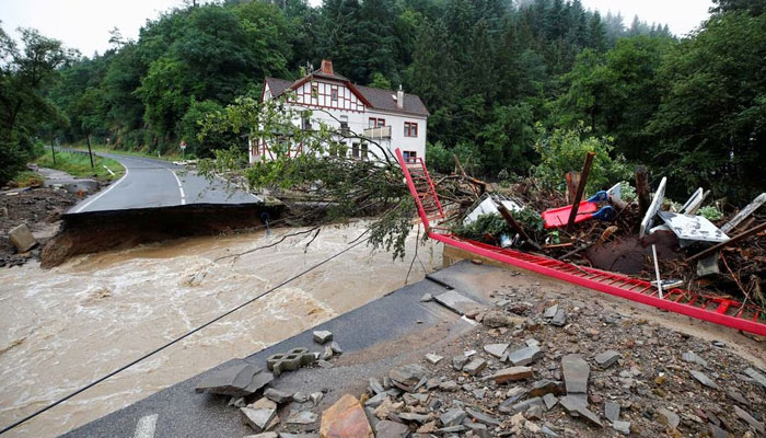 A destroyed road next to the Ahr river is seen on a flood-affected area following heavy rainfalls in Schuld, Germany, on July 15, 2021.-Reuters