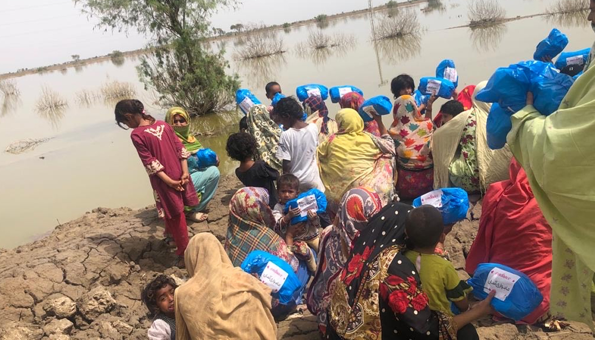Women and girls in a flood-affected area receive sanitary kits by Mahwari Justice. — Mahwari Justice