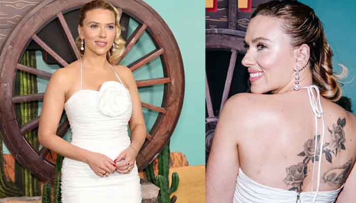 Scarlett Johansson places her costly physique artwork on show in white robe