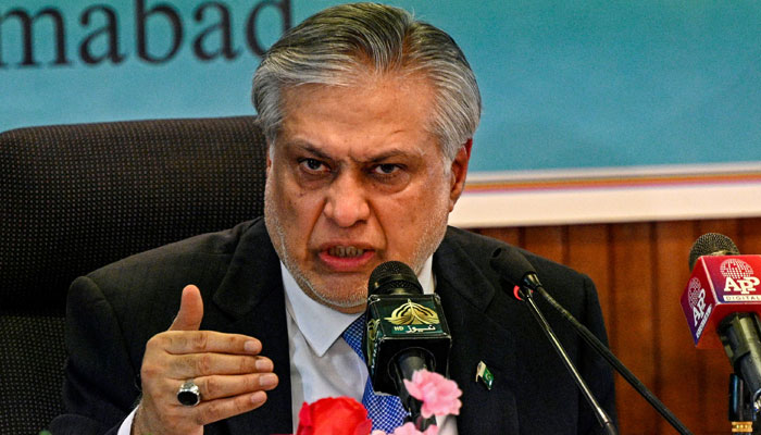 Finance Minister Ishaq Dar addressing a press conference. — AFP/File