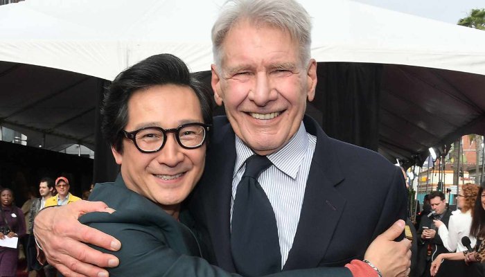 Harrison Ford and co-star Ke Huy Quan reunite with a heartwarming exchange at the premiere of from Indiana Jones