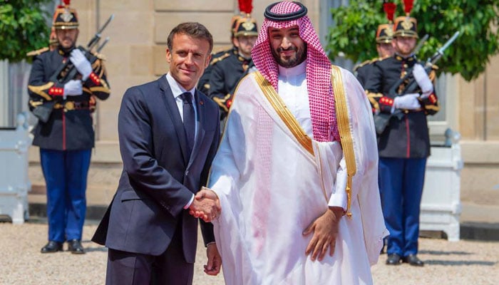 Crown Prince Mohammed bin Salman (right) arrives at Élysée Palace and was received by French President Emmanuel Macron on June 16, 2023. — Twitter/@KSAmofaEN