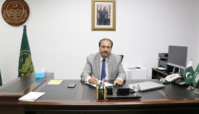 PHEC Dr Shahid Munir photographed in his office. — PHEC website