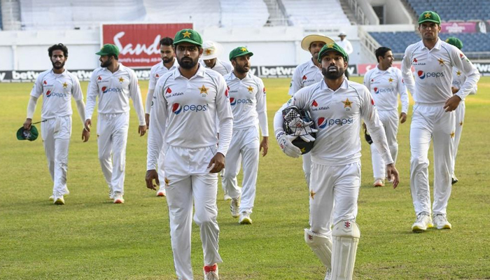 Skipper Babar Azam (left) and wicket-keeper batter Mohammad Rizwan (right) walk back to the pavilion afterTest innings end in this undated photo. — AFP/File