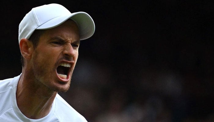 Andy Murray was beaten by John Isner in the second round at Wimbledon.—AFP