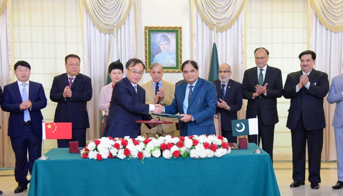 Wang Yongge, President of China National Nuclear Corporation Overseas Ltd (CNOS) and Muhammad Saeed Ur Rehman, Member Power, Pakistan Atomic Energy Commission (PAEC) signing an agreement for Unit 5 of Chashma Nuclear Power Plant (C-5) in Islamabad on June 20, 2023. — PID