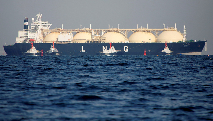 A liquefied natural gas (LNG) tanker is tugged towards a thermal power station in Futtsu, east of Tokyo, Japan November 13, 2017. — Reuters