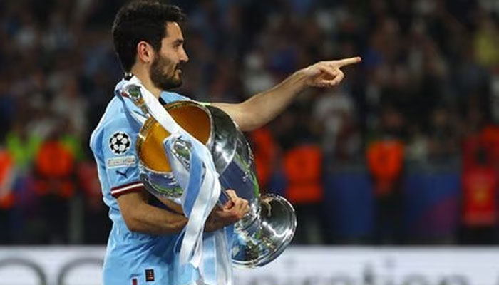 Soccer Football - Champions League Final - Manchester City v Inter Milan - Ataturk Olympic Stadium, Istanbul, Turkey - June 11, 2023, Manchester Citys Ilkay Gundogan celebrates with the trophy after winning the Champions League. —REUTERS