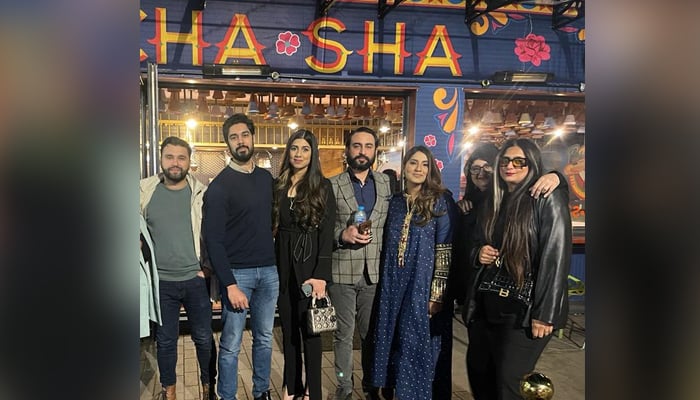 People posing outside the famous London cafe Cha Sha. — Author