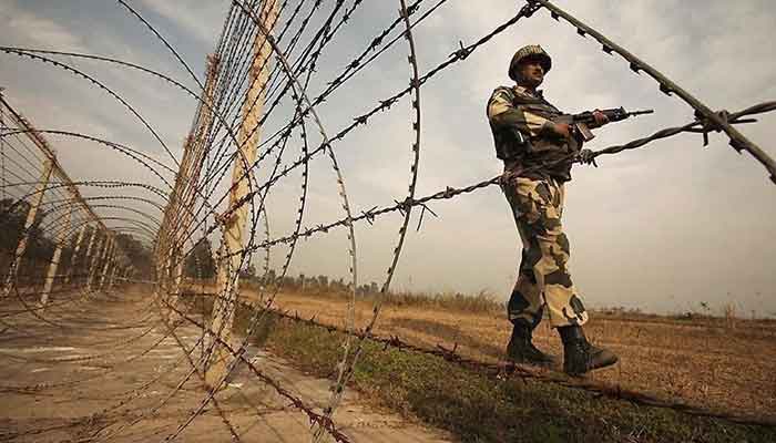 An Indian soldier can be seen standing alongside a barbed wire on the Line of Control. —Reuters/File