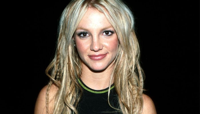 The 41-year-old donned a black crop top and a bright green thong as she displayed her moves