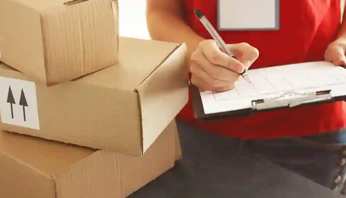 A representational image of a courier representative delivering a package. — Unsplash