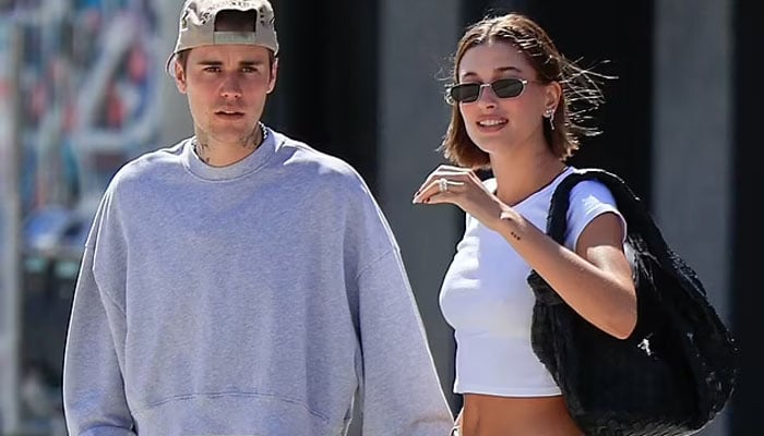 Hailey Bieber flashes her tonned abs as she steps out for breakfast in LA with hubby Justin Bieber