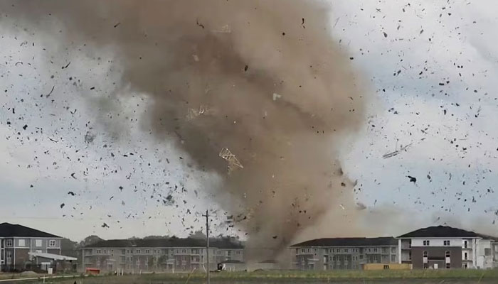 Debris is lifted into the air by a possible tornado during severe weather near Greenwood, Indiana, US, June 25, 2023 in this screen grab obtained from a social media video. — Reuters