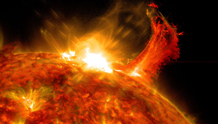 Nasas Solar Dynamics Observatory captured this image of a solar flare on October 2, 2014, showing the bright flash of light at the top with material erupting out into space. — Nasa