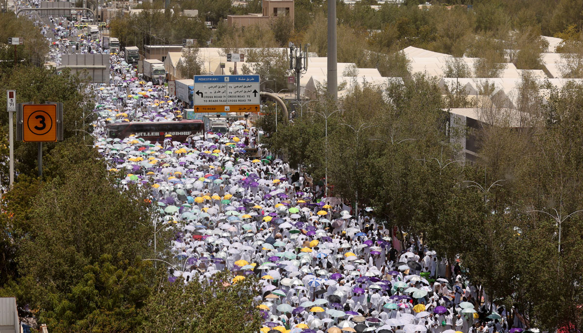 Pilgrims carry umbrellas amid high temperatures outside Namira Mosque on the plain of Arafat during the annual Hajj pilgrimage, outside the holy city of Makkah, Saudi Arabia, June 27, 2023. — Reuters