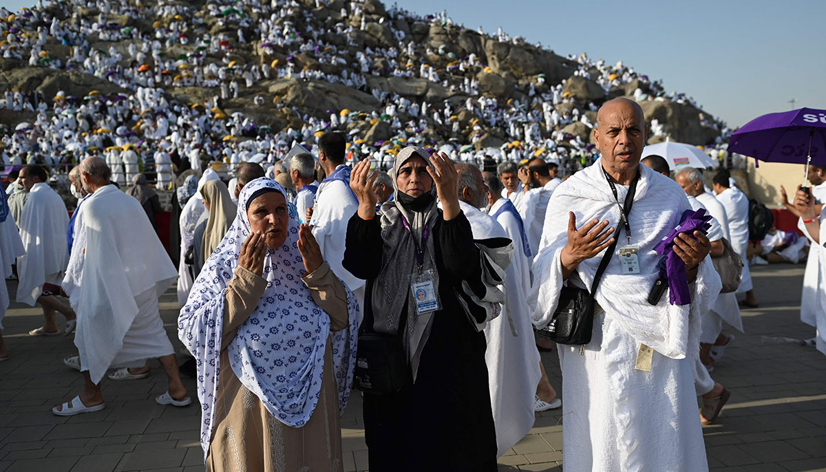 Libyan pilgrim Abdel Latif Abdel Wahab (right) prays along with family members in Mount Arafat, also known as Jabal al-Rahma or Mount of Mercy, during the climax of the Hajj pilgrimage on June 27, 2023. — AFP