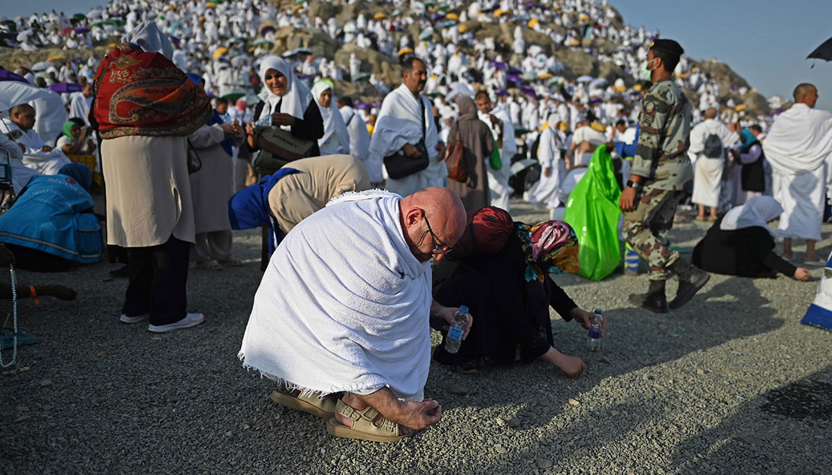 Faithful collect pebbles at Mount Arafat during the climax of the Hajj pilgrimage on June 27, 2023. — AFP