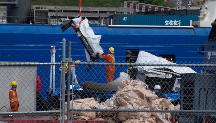 Debris from the Titan submersible, recovered from the ocean floor near the wreck of the Titanic, is unloaded from the ship Horizon Arctic at the Canadian Coast Guard pier in St. John’s, N.L., on Wednesday. — The Canadian Press