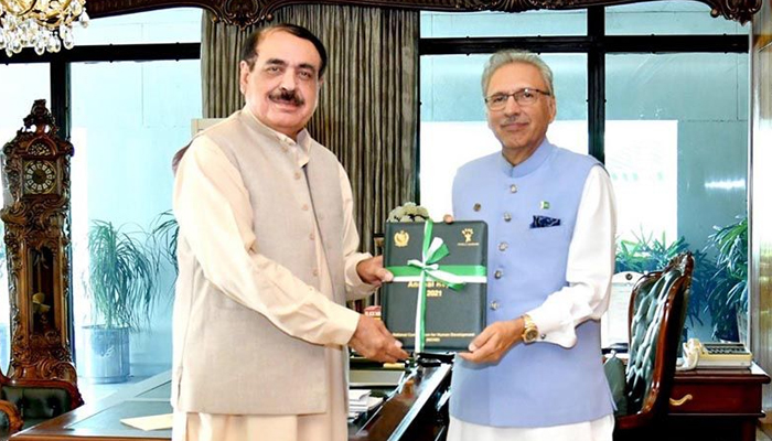Chairman of the National Commission for Human Development Colonel (retd) Amirullah Marwat (left) and President Arif Alvi can be seen in this undated image. — Author