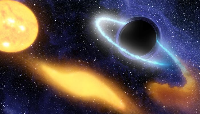 An illustration of a supermassive black hole digesting the remnants of a star. — Nasa/JPL
