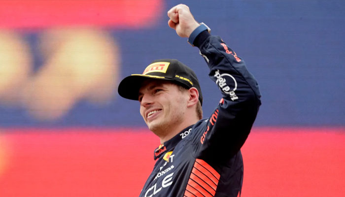 Red Bulls Max Verstappen celebrates on the podium after winning the race.—Reuters