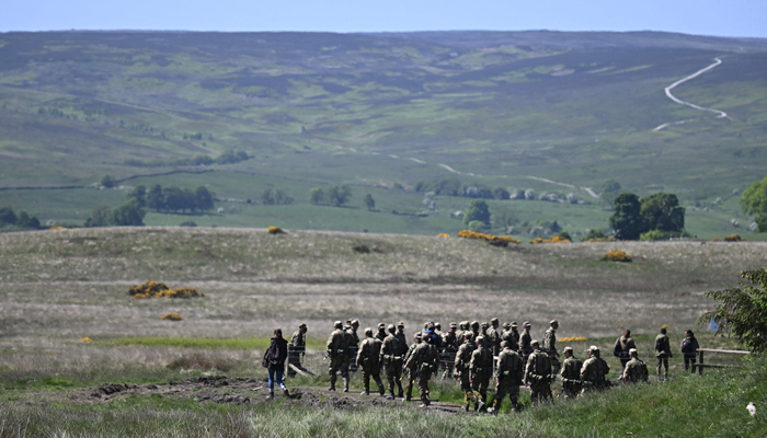 Ukrainian soldiers take part in trench warfare exercises at a British Army military base in Northern England on June 2, 2023. — AFP