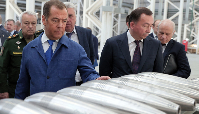 Russias former leader Dmitry Medvedev, a President Putin ally who is now deputy chairman of the security council, visits the Aleksin Experimental Mechanical Plant in the Tula region on June 15, 2023. — AFP