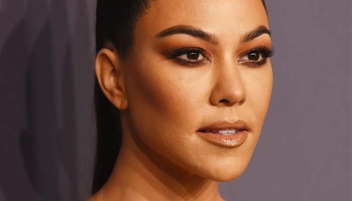 In photos posted to her Instagram, Kourtney enjoyed her time poolside while donning a string bikini