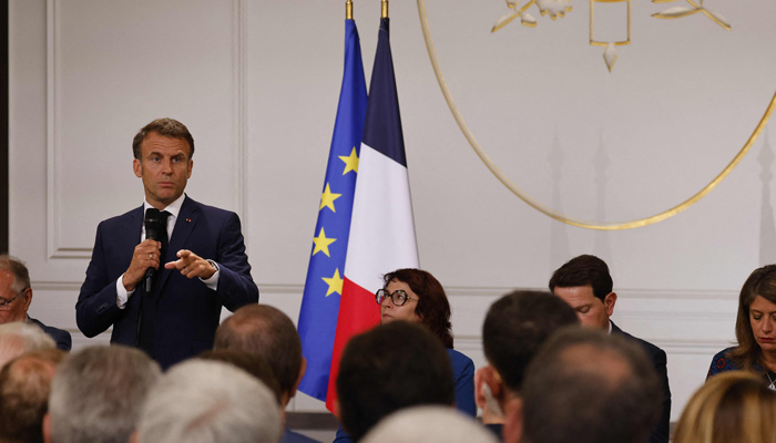 Frances President Emmanuel Macron addresses mayors of cities affected by the violent clashes that erupted after a teen was shot dead by police last week during a meeting at the presidential Elysee Palace in Paris on July 4, 2023. — AFP