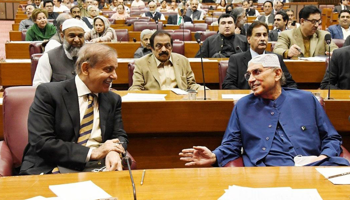 Prime Minister Shehbaz Shraif exchanging views with PPP Co-Chairman Asif Ali Zardari at National Assembly in Islamabad on April 27, 2023. — Online