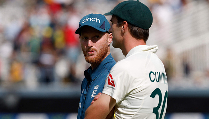 Englands captain Ben Stokes (left) and Australias Pat Cummins (right) chat on the field after Australia win on day five of the second Ashes cricket Test match between England and Australia at Lord´s cricket ground in London on July 2, 2023. — AFP