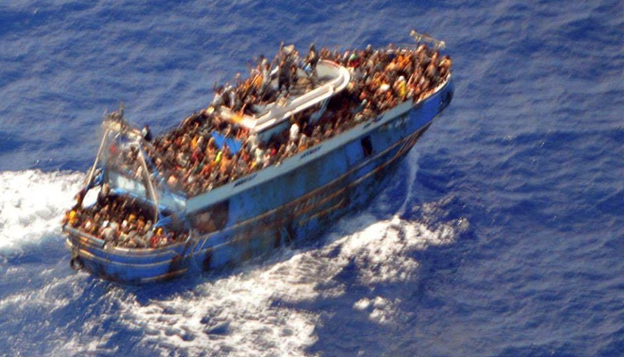 A photo shows migrants before their boat capsized on the open sea off Greece on June 14, 2023. — Reuters