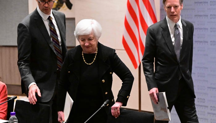 US Treasury Secretary Janet Yellen (L) arrives with the President of the American Chamber of Commerce in China Michel Hart (C) and US Ambassador to China Nicholas Burns at the Business round table, in Beijing on July 7, 2023. — AFP