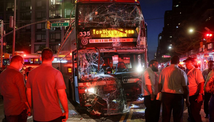 The front window of a bus is seen completely shattered at the site of a bus crash in the Manhattan borough of New York City, where a double-decker and a city bus crashed. - Reuters