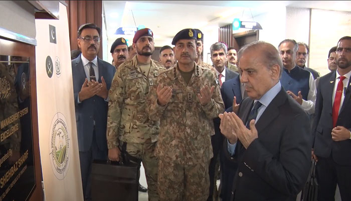 Prime Minister Shehbaz Sharif and Chief of Army Staff (COAS) Gen Asim Munir offering prayers after the inauguration of the LIMS — COE. — YouTube/APP