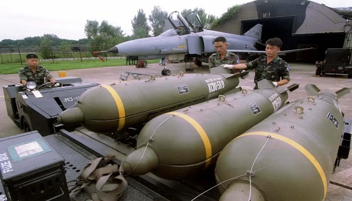 Members of the South Korean Air Force prepared to load cluster bombs onto a fighter during an exercise in August at an air base in Suwon, South Korea. — Reuters/File