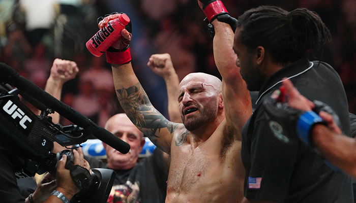 Alexander Volkanovski (red gloves) reacts after defeating Yair Rodriguez during UFC 290 at T-Mobile Arena on July 8. — Reuters