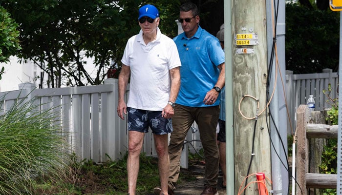 US President Joe Biden leaves the beach near his home in Rehoboth Beach, Delaware, July 8, 2023, as he spends the weekend at his vacation home. — AFP
