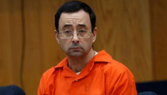 Larry Nassar listens to victims impact statements during his sentencing. — Reuters/File