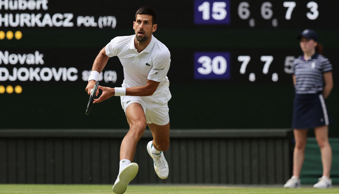 Serbia’s Novak Djokovic runs to play a return against Poland’s Hubert Hurkacz during their men’s singles tennis match on the eighth day of the 2023 Wimbledon Championships at The All England Tennis Club in Wimbledon, southwest London, on July 10, 2023. — AFP