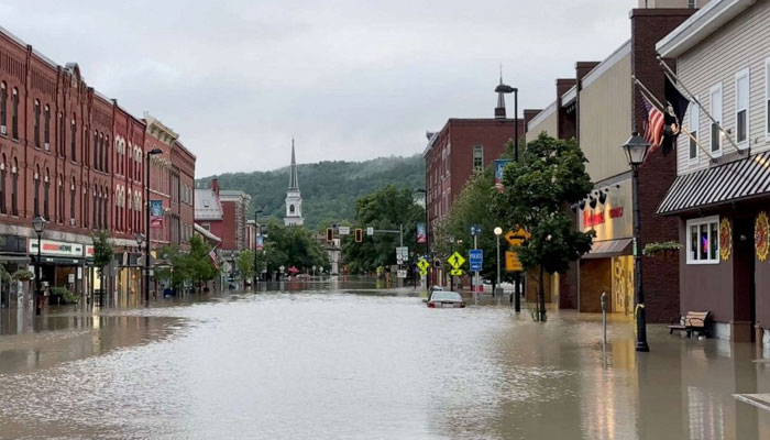 A vehicle is partially submerged in a flooded street, in Montpelier, Vt., July 11, 2023. Reuters